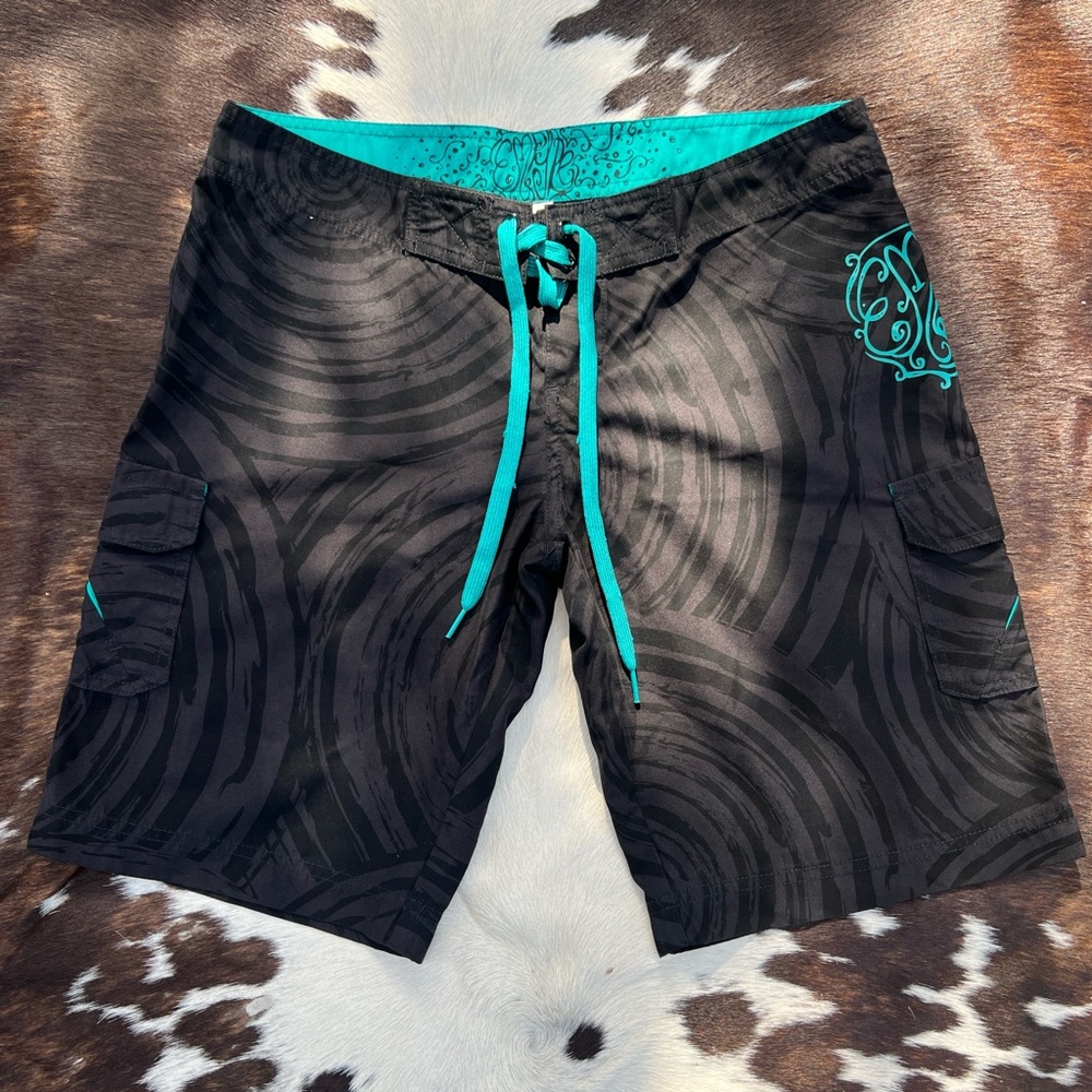 Y2K era vintage two-tone black and teal Empyre lace-up board shorts